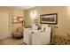 Laundry room features new machines, seating, and bulletin board at 9940 47Th N Ave # 210, St Petersburg, FL 33708