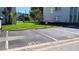 Assigned parking spot in a well-maintained parking lot. Numbered parking spots visible at 9940 47Th N Ave # 210, St Petersburg, FL 33708