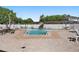 Sparkling community swimming pool area, surrounded by lounge chairs and a white fence at 9940 47Th N Ave # 210, St Petersburg, FL 33708