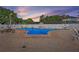 Community pool featuring a blue, resort-style design with brick accents and ample seating at 9940 47Th N Ave # 210, St Petersburg, FL 33708