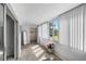 Bright sun room with large windows offering views of the community's well-maintained landscaping at 9940 47Th N Ave # 210, St Petersburg, FL 33708