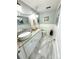 Bathroom featuring a vessel sink on a granite countertop, elegant decor, and stylish light fixtures at 100 Bluff View Dr # 502C, Belleair Bluffs, FL 33770