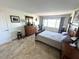 The bedroom is nicely furnished and includes a bright window with nice views at 100 Bluff View Dr # 502C, Belleair Bluffs, FL 33770