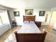 Bedroom showcasing a bed frame, bedside tables, stylish decor, and plenty of light at 100 Bluff View Dr # 502C, Belleair Bluffs, FL 33770