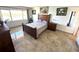 Bright bedroom has neutral colors, a bed, large window, and a water view at 100 Bluff View Dr # 502C, Belleair Bluffs, FL 33770