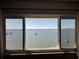 Bedroom view reveals stunning waterfront views and sailboats sailing in the distance at 100 Bluff View Dr # 502C, Belleair Bluffs, FL 33770