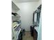 Walk-in closet featuring ample shelving and storage space for organization at 100 Bluff View Dr # 502C, Belleair Bluffs, FL 33770