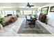 Open-concept living space featuring marble floors, dining area, and stunning water views at 100 Bluff View Dr # 502C, Belleair Bluffs, FL 33770