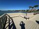 Waterfront dock with built-in seating and a view of the clear blue sky at 100 Bluff View Dr # 502C, Belleair Bluffs, FL 33770