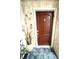Inviting front door with brick surround, decorative elements, and a stylish entry mat at 100 Bluff View Dr # 502C, Belleair Bluffs, FL 33770