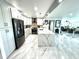 Modern kitchen with marble countertops, stainless steel appliances, and tiled flooring at 100 Bluff View Dr # 502C, Belleair Bluffs, FL 33770
