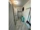 Laundry room showcasing stacked washer and dryer, with cabinets and extra storage space at 100 Bluff View Dr # 502C, Belleair Bluffs, FL 33770