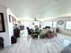 Bright and open living room with large windows offering water views, marble floors, and stylish furnishings at 100 Bluff View Dr # 502C, Belleair Bluffs, FL 33770