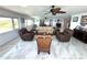 Bright living room with marble floors, comfortable seating, and expansive water views at 100 Bluff View Dr # 502C, Belleair Bluffs, FL 33770