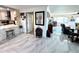 Spacious living area with marble floors, an elegant cabinet, and easy access to adjoining rooms at 100 Bluff View Dr # 502C, Belleair Bluffs, FL 33770