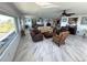 Spacious living room boasting marble floors, comfortable seating, and a bright, open feel at 100 Bluff View Dr # 502C, Belleair Bluffs, FL 33770