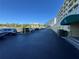 View of the building's parking lot with parking spaces and a view of the inter coastal waterway at 100 Bluff View Dr # 502C, Belleair Bluffs, FL 33770