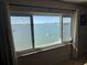 Window water view including cityscape and sailboats at 100 Bluff View Dr # 502C, Belleair Bluffs, FL 33770