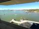 Stunning water view from a condo with dock, boats, and coastal cityscape visible through the window at 100 Bluff View Dr # 502C, Belleair Bluffs, FL 33770