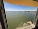 Stunning view of the water, highlighting the nearby pier and distant skyline at 100 Bluff View Dr # 502C, Belleair Bluffs, FL 33770