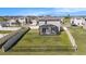 Aerial view of the house showing a large yard and screened patio at 10506 Penny Gale Loop, San Antonio, FL 33576