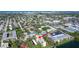 Aerial view of community featuring a pool, tennis court, and waterfront condos at 11485 Oakhurst Rd # A202, Largo, FL 33774