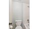 Bathroom featuring a toilet and tiled shower/tub combination with chrome fixtures at 11485 Oakhurst Rd # A202, Largo, FL 33774