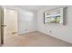 Relaxing bedroom with a bright window and adjacent bathroom at 11485 Oakhurst Rd # A202, Largo, FL 33774