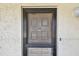 View of the front door and exterior of home showcasing address 202 at 11485 Oakhurst Rd # A202, Largo, FL 33774