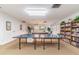 Game room with ping pong table and bookshelf at 11485 Oakhurst Rd # A202, Largo, FL 33774