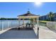 A gazebo overlooks the serene lake, providing a relaxing outdoor space for community members at 11485 Oakhurst Rd # A202, Largo, FL 33774