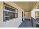 Hallway view of the exterior of building, showing stucco and railing at 11485 Oakhurst Rd # A202, Largo, FL 33774