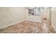 The condo's hardwood floors are showcased from the living room into the dining room at 11485 Oakhurst Rd # A202, Largo, FL 33774