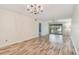 Open living room with hard wood flooring and lots of natural light at 11485 Oakhurst Rd # A202, Largo, FL 33774