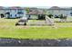 Aerial view of fenced backyard with a pond, shed, and patio at 11872 Thicket Wood Dr, Riverview, FL 33579