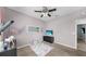 Cozy bedroom with carpet, ceiling fan, and a playful unicorn-themed decor creates an inviting and imaginative space at 11872 Thicket Wood Dr, Riverview, FL 33579