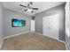 Bedroom with ceiling fan, carpet, and light gray walls makes this an inviting space for rest and relaxation at 11872 Thicket Wood Dr, Riverview, FL 33579