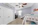 bedroom featuring bunk beds with a slide, carpet and large closets for a practical and comfortable space at 11872 Thicket Wood Dr, Riverview, FL 33579
