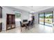 Bright dining room features a large window and access to the backyard at 11872 Thicket Wood Dr, Riverview, FL 33579