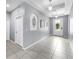 Well-lit foyer with decorative wall cutouts and neutral color palette at 11872 Thicket Wood Dr, Riverview, FL 33579