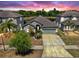 Charming single-story home featuring a well-manicured lawn, mature landscaping, and a two-car garage at 11872 Thicket Wood Dr, Riverview, FL 33579