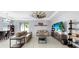 Open concept living room and dining room with lots of natural light at 11872 Thicket Wood Dr, Riverview, FL 33579