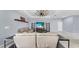 Spacious living room with a modern ceiling fan and a large television at 11872 Thicket Wood Dr, Riverview, FL 33579
