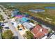 Aerial view of homes with canal access and boat docks near coastal wetlands at 12821 5Th Isle, Hudson, FL 34667