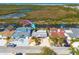 Aerial view featuring homes with canal access, boat docks, and nearby marshland at 12821 5Th Isle, Hudson, FL 34667