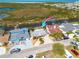 Aerial view showcasing waterfront homes with canal access near coastal wetlands at 12821 5Th Isle, Hudson, FL 34667