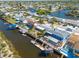 Aerial view of waterfront homes with docks, canals, and neighborhood streets at 12821 5Th Isle, Hudson, FL 34667