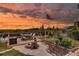 Backyard featuring a charming deck with a fire pit, ideal for relaxing evenings outdoors at 12821 5Th Isle, Hudson, FL 34667