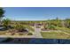 A lovely backyard features stone pavers and garden spaces leading to a wood deck at 12821 5Th Isle, Hudson, FL 34667