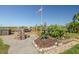 Inviting backyard with a deck, lush garden, and a bird bath with mature landscaping at 12821 5Th Isle, Hudson, FL 34667
